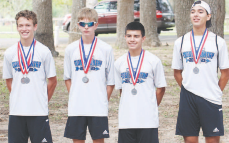 Yoakum High School Varsity Bulldogs showcase medals at the Cross Country District Meet on Oct. 9 in Yoakum. Photo courtesy of Raymond Rosas.