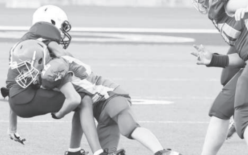 A SJS player makes a tackle during the football game against the Trinity Episcopal Patriots. Photo courtesy of Raymond Rosas.