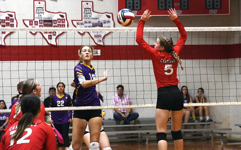 Skylar Mozisek tries a block in the Oct. 23 match against Austin Waldorf. Mozisek and the Lady Cardinals played Dallas First Baptist on Tuesday in the area round. Photo by Mark Lube.
