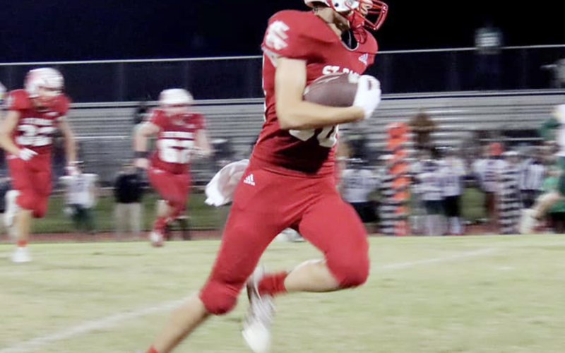 Jack Ehrig carries the ball against Fort Worth Temple Christian. He ran three times for 38 yards and caught one pass for seven yards. Photo courtesy of Brian and Louann Heinsohn.