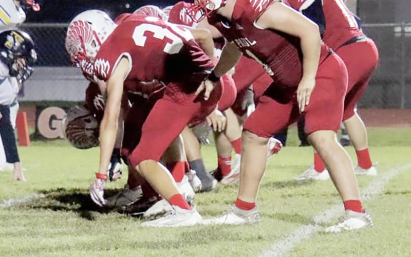 The St. Paul Cardinals line up for point-after play during the bi-district round Friday night against Fort Worth Temple Christian at Comanche Stadium. Photo courtesy of Brian and Louann Heinsohn.