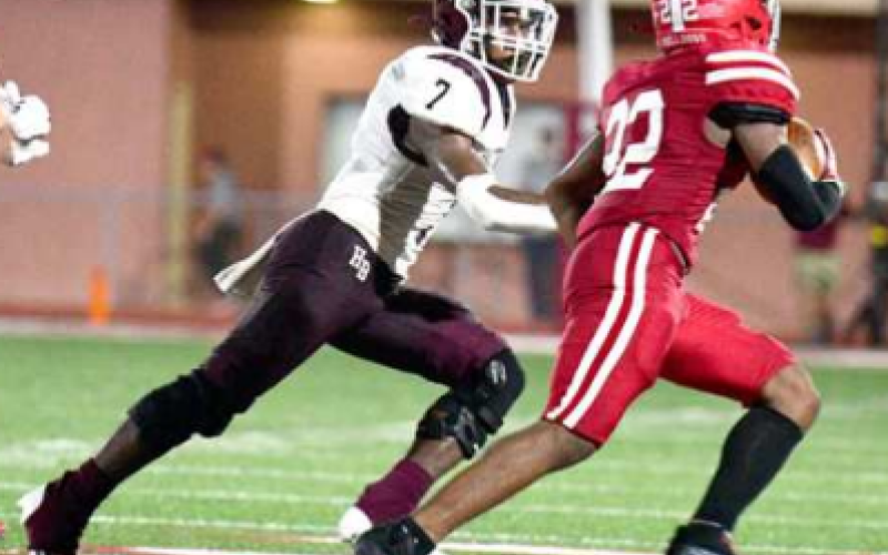 Rashaun Sidney chases down Hitchcock’s Jared Dodson. Chuck Grafe/Tribune-Herald