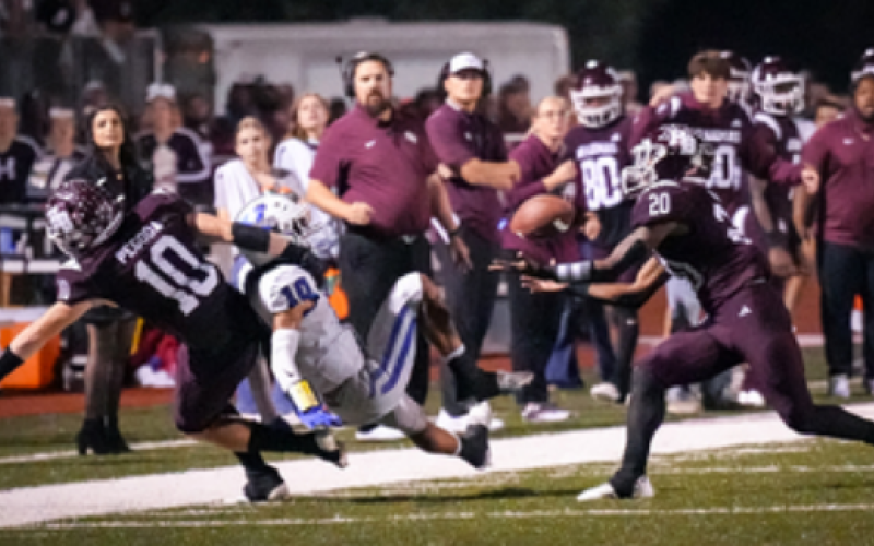 Linebacker Jashaun Price (20) intercepts a pass with 1:34 remaining in the fourth quarter to seal the victory over Yoakum. Photo by Howard Esse