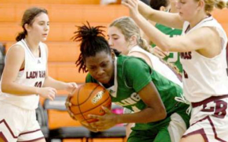Alaina Halata, right, and Haven Drozd, background, defend in the post vs. Boling Friday. Chuck Grafe/Tribune-Herald