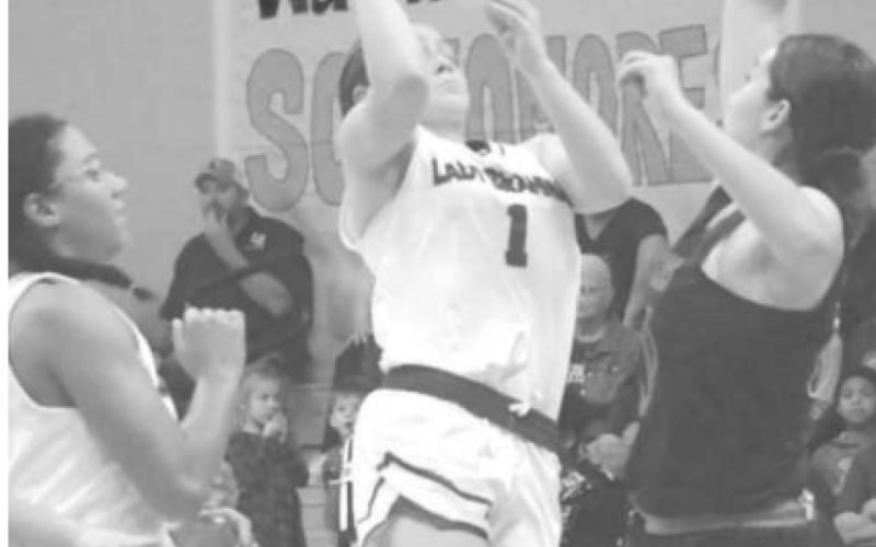 Lady Brahma Layten Kolacny scores over Sharkette Maddy Wollam Chuck Grafe/Tribune-Herald