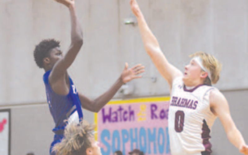 Nathan Henke goes up to block a shot by Rice’s Robert Barnett. Chuck Grafe/Tribune-Herald