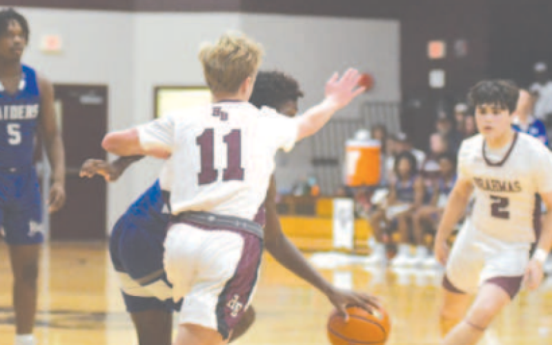 Shane Migura defends in the loss to Rice Consolidated here Friday night. Chuck Grafe/Tribune-Herald