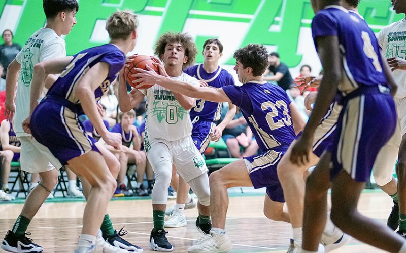 Shiner players Boe Boehm, Jake Simper, Carson Schuette and Quincy Jones play some defense in the Comanche’s win at Bloomington on Jan. 23. Photo courtesy of Howard Esse.