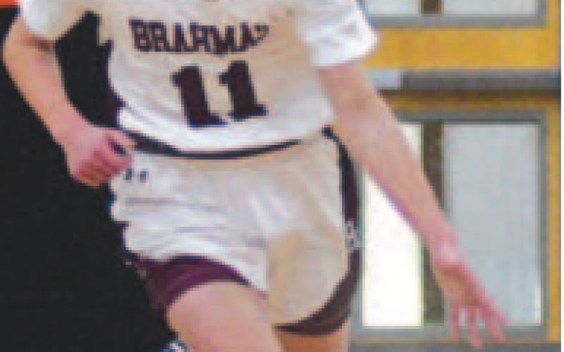 Shane Migura brings the ball up court vs. Schulenburg. Chuck Grafe/Tribune-Herald