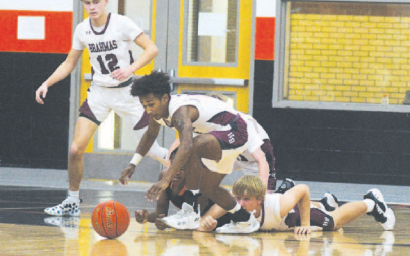 Jashaun Price eyes a loose ball during the win over Schulenburg. Chuck Grafe/Tribune-Herald