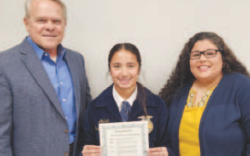 Pictured in the center is Andrea Reyes-Martinez. She was recognized at the state level for Spanish speaking at the 2023 FFA Texas Leadership event. Pitcured at left is President Glen Kusak. Pictured at right is Advisor Adrianna Bridges.
