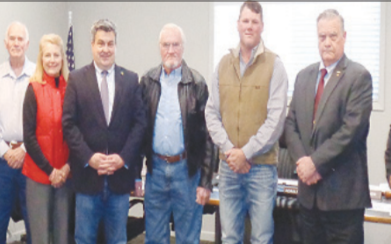 Pictured (at left) from left to right are Board of Director members, Walt Hairell, Lonny Montgomery, Deborah Sevcik, Judge Keith Mudd, Ronald Braeuer, Roddy Renger, James Fenner, and Fred Hilscher. Contributed photo.