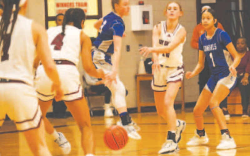 Alaina Halata makes a pass into the post to Macy Herring. Chuck Grafe/Tribune-Herald