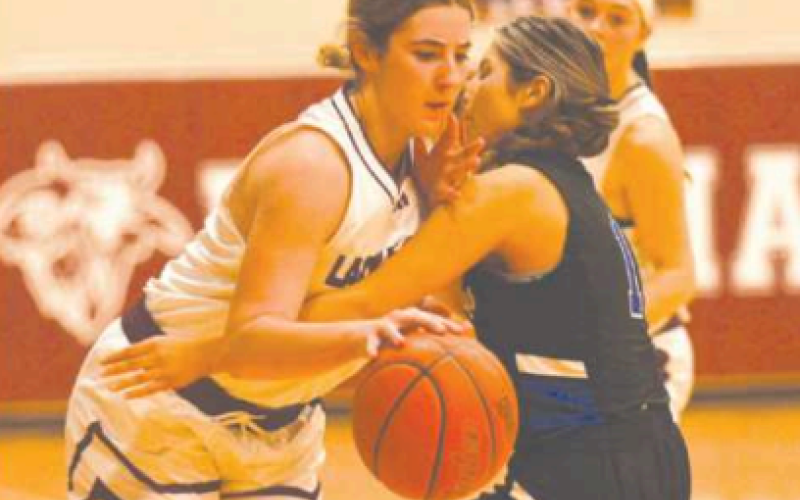Haven Drozd works her way around a Yoakum Defender in the 4th quarter.