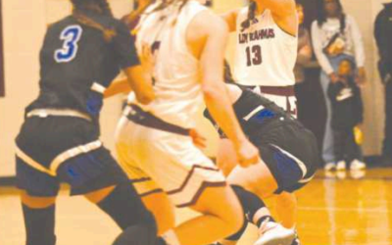 Addison Matula (13) is about to make a pass to Layten Kolancy.