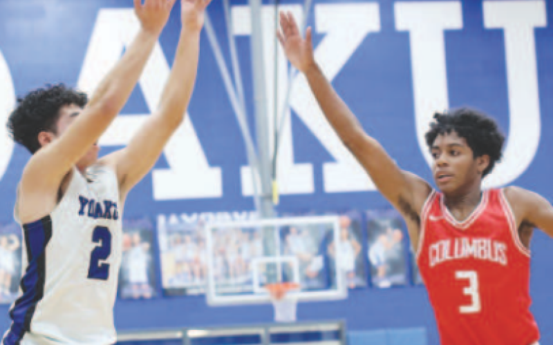 Isaac Martinez shoots the ball in Yoakum against Columbus on Jan. 23. Photo courtesy of Raymond Rosas.