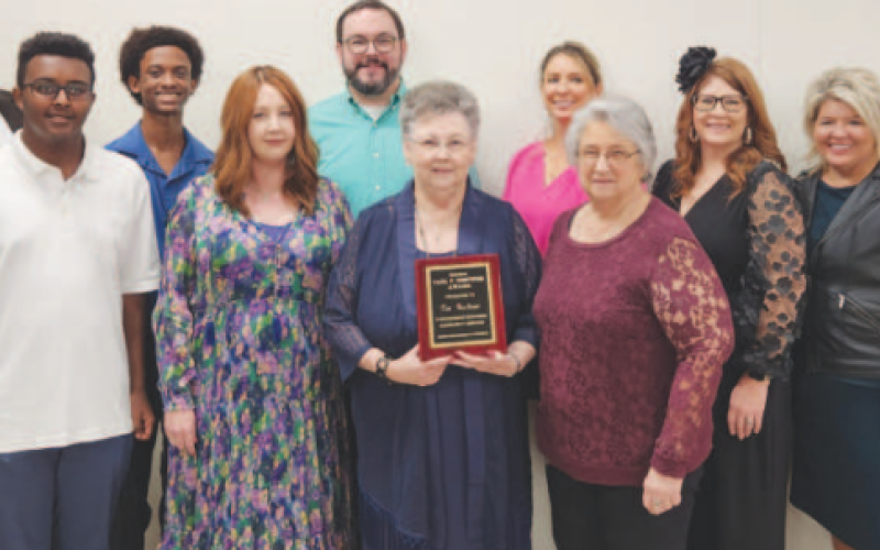 Tim Faulkner was posthumously awarded the 2024 Paul F. Gustwick Award during the 106th Yoakum Chamber of Commerce (YACC) Awards Banquet held on Jan. 25. Pictured in the center is Martha Faulkner, along with Faulkner family members, 2023 Paul F. Gustwick Award recipient William “Bill” Wimberly’s family members, and YACC directors. Staff photo.