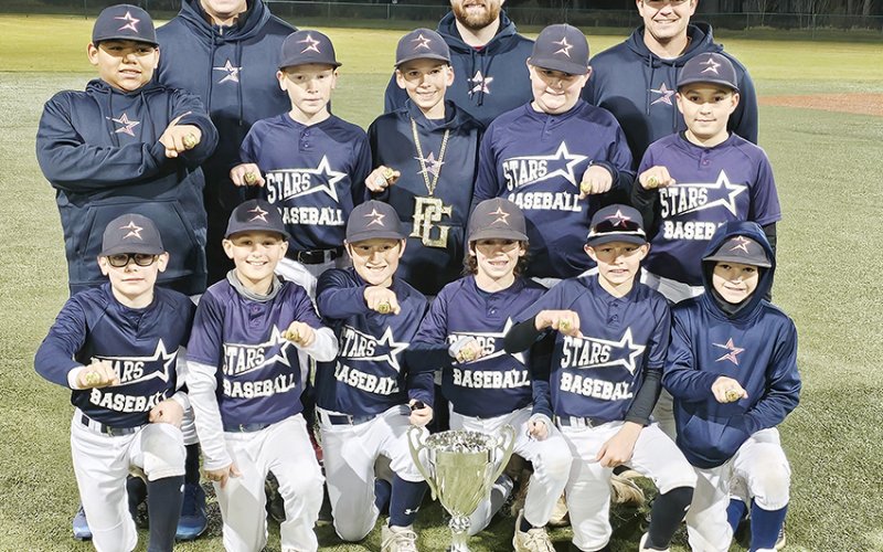 Front row from left are Nicholas Simper, Beckett Heibel, Ayden McCord, Kolt McFarlin, Landon Chovanetz, and Ryder Robinson. Second row from left are Alonzoe Saldana, Jase Peters, Paul Filip, Payten McCord, and Jax Davila. Back row from left are  Coach Blue Hybner, Coach Austin Popp, and Coach Cole Hybner. Not pictured is Luke Spann. Photo courtesy of Kevin Filip.