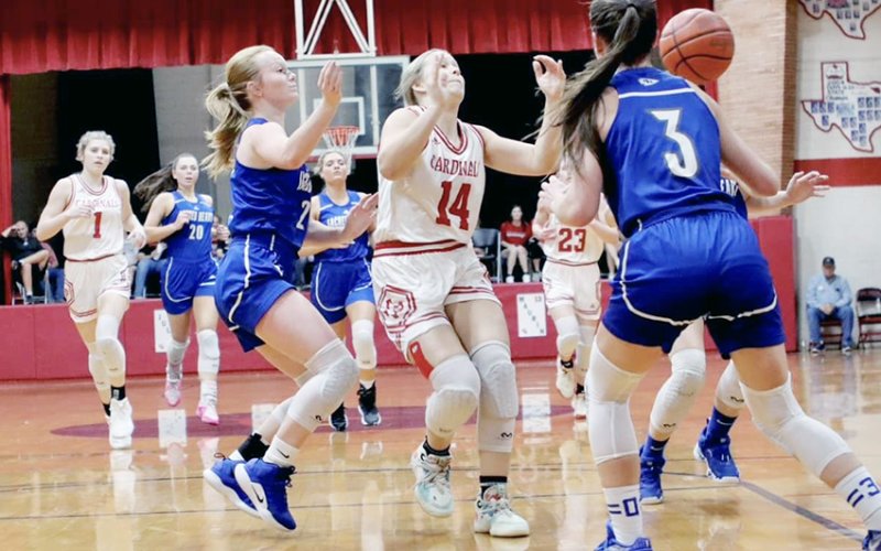 Avery Pesek sends off a pass against Sacred Heart on Thursday. She scored 10 points in the Feb. 6 game at Pflugerville Concordia. Photo courtesy of Louann Heinsohn.