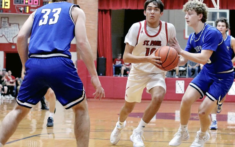 Zeke Rodriguez enters the paint Thursday against Sacred Heart. He led the Cards in the previous game at Pflugerville Concordia (Feb. 6) with 13 points. Photo courtesy of Louann Heinsohn.