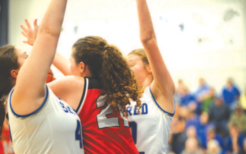 Harley Wilson, left, and Allison Clark apply pressure vs. Pflugerville Concordia. Chuck Grafe/ Tribune-Herald