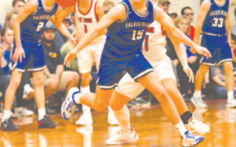 Nic Angerstein goes after a loose ball to cause a turnover in the SP game Thursday. Chuck Grafe/Tribune-Herald
