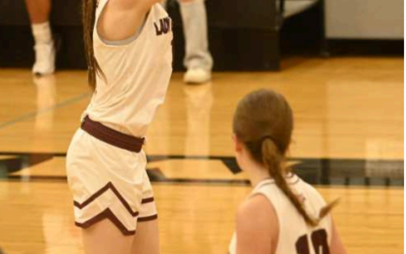 Layten Kolacny shoots a three against Nixon-Smiley. Chuck Grafe/ Tribune-Herald