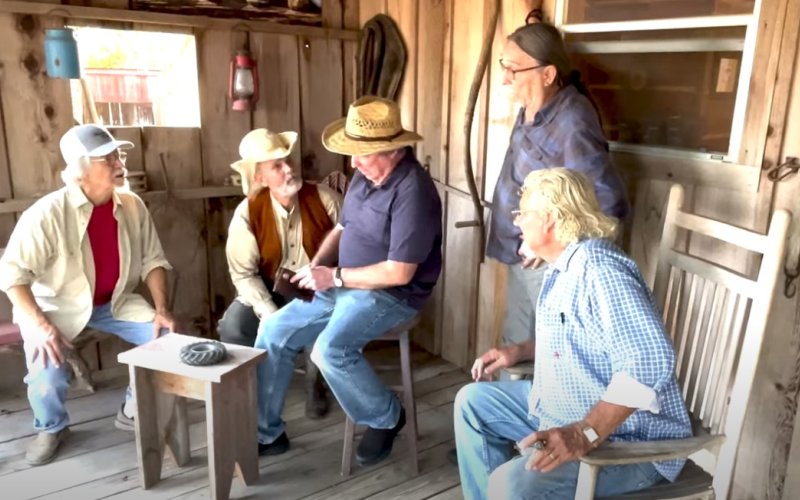 The guys act out one of the scenes of the video, where Nick Shimek goes for his cash only to find none. Pictured from left are Howard Gloor, Brian Beran, Shimek, Bobby Kallus and Waldo Boehm.