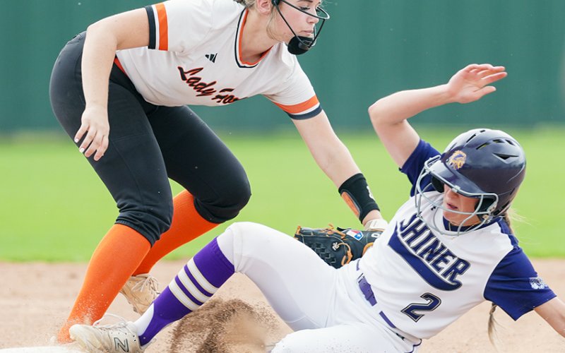 Schulenburg’s Hailey Kahlden gets a tag out on Lady Comanche Callie Sevcik at the tail end of a double play. Despite getting putout here, Sevcik still scored two runs on two hits with a double. Photo courtesy of Howard Esse.