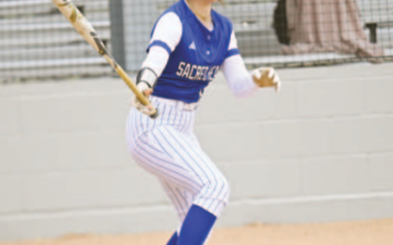 Emma Demel admires her double vs. Austin Brentwood. Chuck Grafe/Tribune-Herald