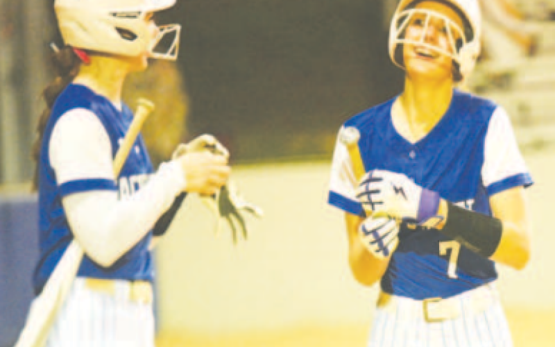Rylan Dworsky, right, after scoring a run. Chuck Grafe/TribuneHerald