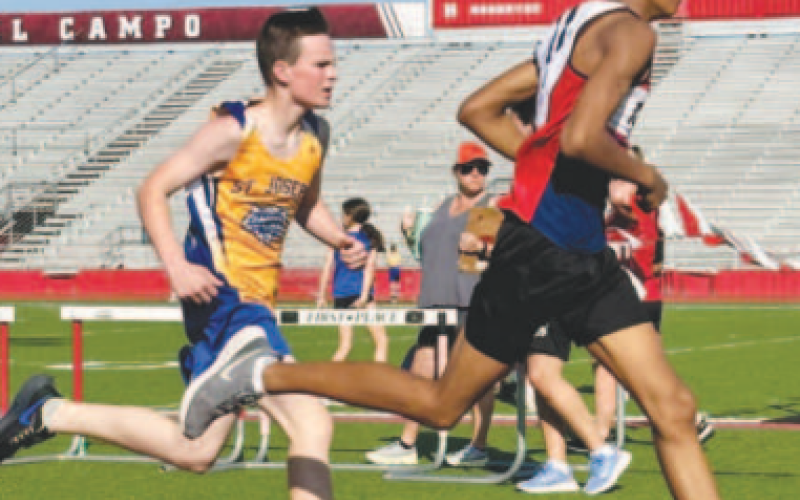 SJS Tiger Dominic Novak (In yellow) finished second in a close race in the 800-meter run in El Campo at the St. Philip’s Track Meet with a time of 2:23:81. Trinity EpiscopalVictoria placed first at the finish line. Contributed photo.