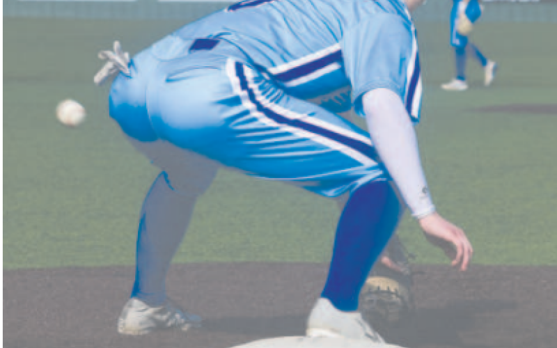 Indian first baseman Emerson Harvey digs out a low throw vs. Shiner. Chuck Grafe/Tribune-Herald