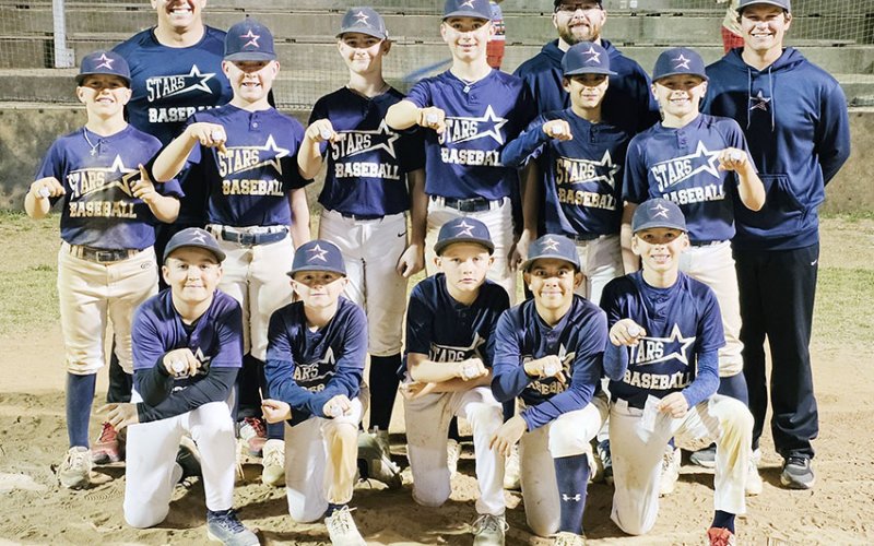 Pictured front row from the left are Jax Davila, Gabe Werner, Casen Watts, Elijah Rodriguez and Paul Filip. Second row from the left are Jude Boedeker, Luke Spann, Cash Weaver, Jaxson Hill, Elias Gomez and Aadin Koopman. Back row from the left are  Coach Blue Hybner, Coach Austin Popp and Coach Cole Hybner. Not pictured: Matt Mozisek.