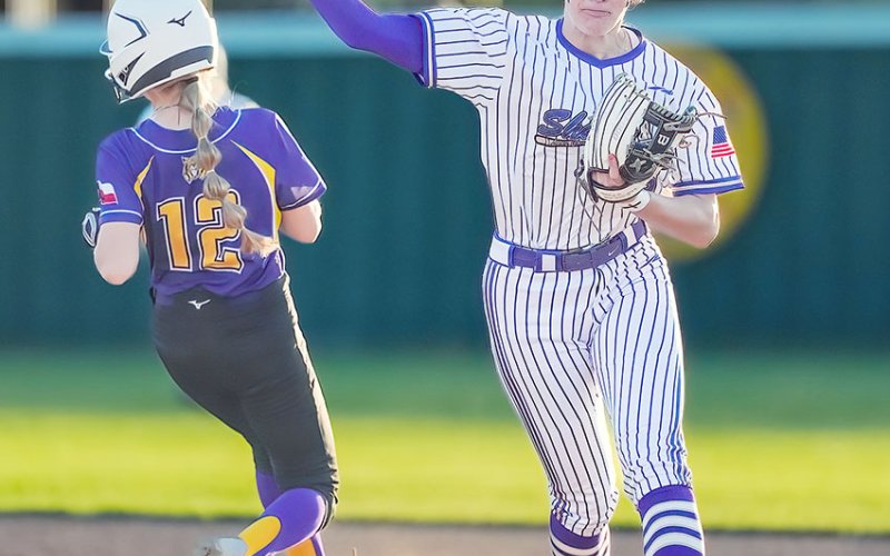Addy Siegel tries to complete the second out of a double- play attempt against Weimar March 26 in Shiner. Photo courtesy of Howard Esse.
