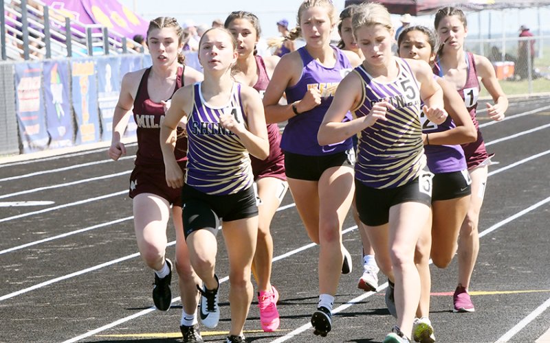 Emma Joslin (left) and Hayleigh Burns (right) on the track in Thrall during the 800-meter run. Burns placed second and Joslin was third. Photo by Mark Lube.
