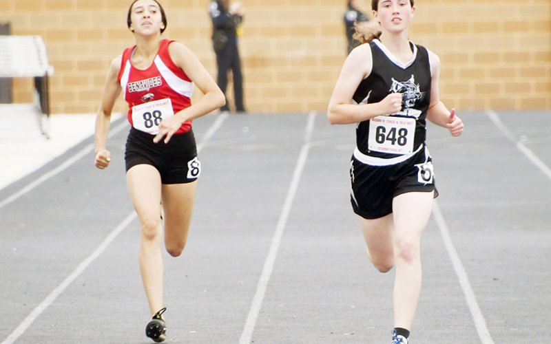 ddison Simper on the track during the 200-meter preliminaries. She got sixth in the prelims and seventh in the finals. Photo by Mark Lube.