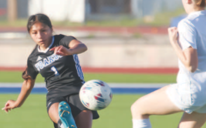 YHS Lady Bulldog Soccer player Makayla Olmedo kicks the ball. Photo courtesy of Raymond Rosas.