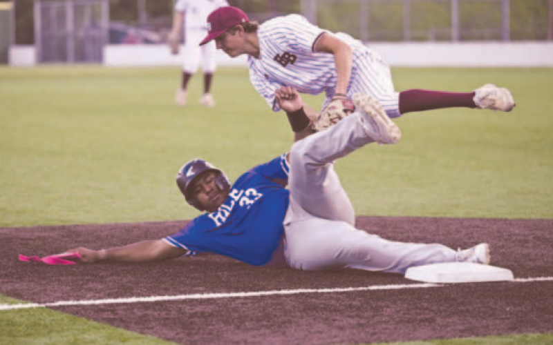 Brahma third baseman Luke Henneke tags out Rice’s John Hailey at third base in the third inning of the game here Friday. Chuck Grafe/Tribune-Herald