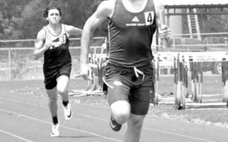 Andrew Steffek anchors the 800-meter relay. Chuck Grafe/Tribune-Herald