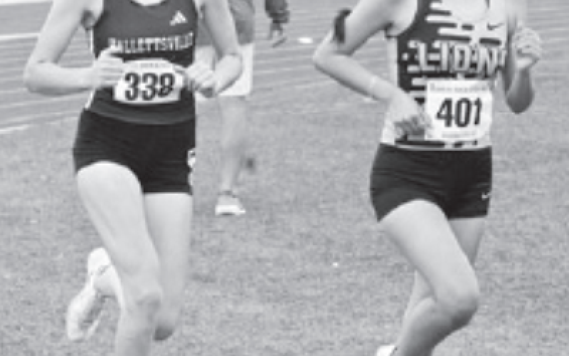 Elizabeth Felcman, left, broke her own school record in the 3200. Chuck Grafe/Tribune-Herald