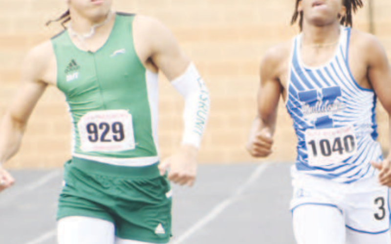 Pictured above at right is Chase Polk. He placed second in the 400-meter dash to advance to state. Photo by Mark Lube.