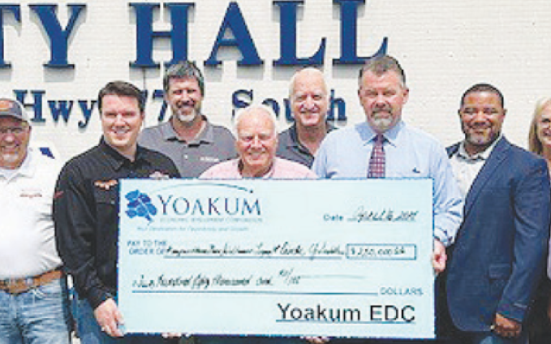 YEDC reimbursed a $250,000 grant for improvements at Circle Y. From left to right are YEDC Secretary Linda Schmidt, YEDC Executive Director Genora Young, Tucker Saddles Vice President Darrell Nephew, Circle Y President Garrett Bottlinger, Kaspar Companies Board Member Michael Trojcak, YEDC Board Member Doug Kaspar, City of Yoakum Mayor Carl O’ Neill, YEDC President Layne Brandt, Kapsar Companies COO Peter Robinson, YEDC Board Member Pam Ward, Circle Y Distribution Manager Mark Jemelka