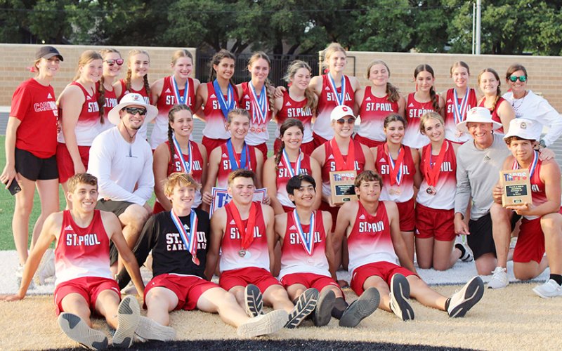 The St. Paul girls and boys track teams along with coaches Emily Mieschen, Nicco Brown, Ryan Geiger and Jake Wachsmuth gather for team photo after the regional meet Friday in Seguin.Not shown are coaches Emma Mikulik and Karli Rodriguez. Photo courtesy of Jake Wachsmuth.