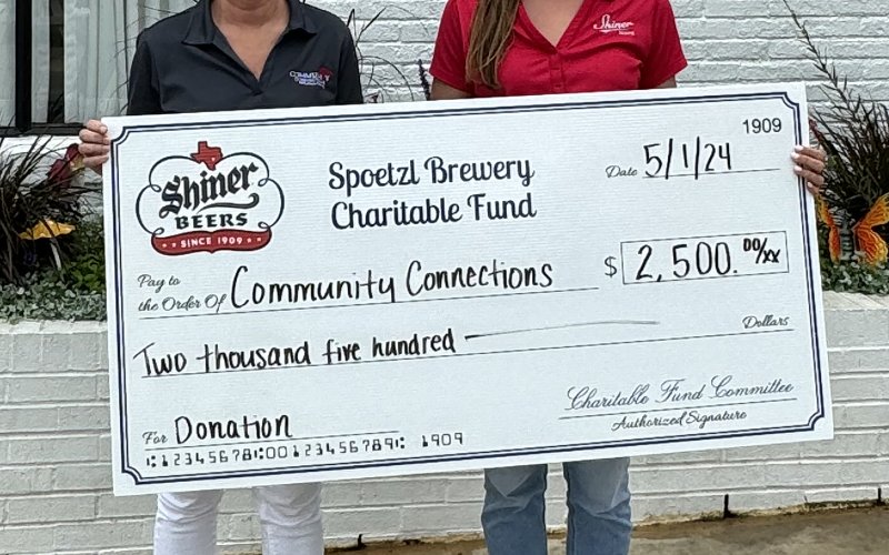 Pictured are Becky Janak, Community Connection Program Manager, left, and Lauren Petras, Spoetzl Charitable Fund member.