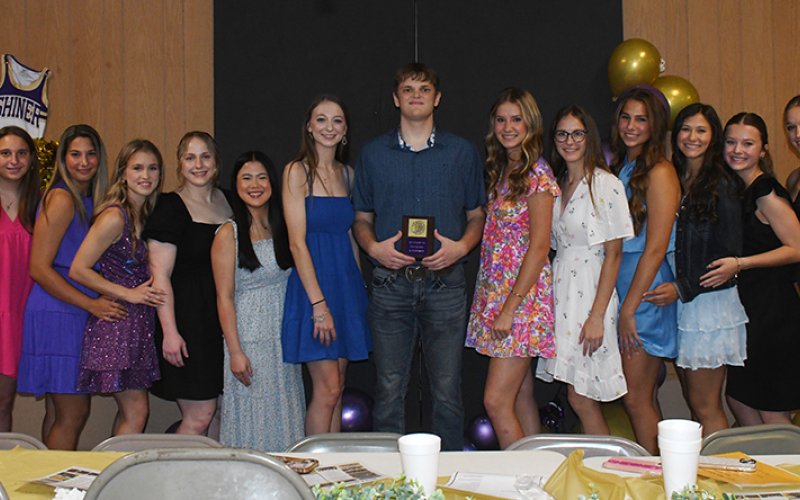 Cheerleader Beau Colton Winkenwerder (middle). Also shown from left are Valerie Bordovsky, Bianca Rainosek, Hayleigh Burns, Charlotte Grosenbacher, Addie Kalich, Amelia Pohler, Aimee Mitchon, Grace Migl, Chesney Machacek, Brooke Palmer, Kacey Kramer and Callie Sevcik. Photo by Mark Lube.