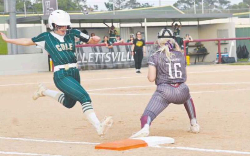 Grace Halata makes a put out at first base in the first inning. Chuck Grafe/Tribune-Herald