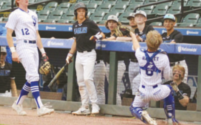 Indian catcher Emerson Harvey makes a great catch in from of the Brazosport Christian as first baseman Wade Shimek looks on.. Lisa Noska for the Tribune-Herald.