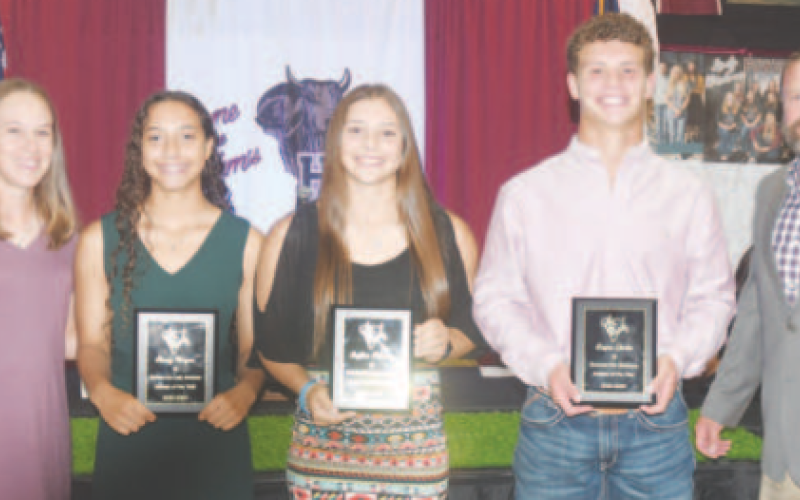 Pictured in the middle, from left, are the Athletes of the Year named at the Sports Award Ceremony Sunday night at the KC Hall. Kasey Harper, Layten Kolacny and Layne Gerke. At left is Girls Athletic Coordinator, Callie Kresta and right is AD Levi Montgomery. Chuck Grafe/Tribune-Herald
