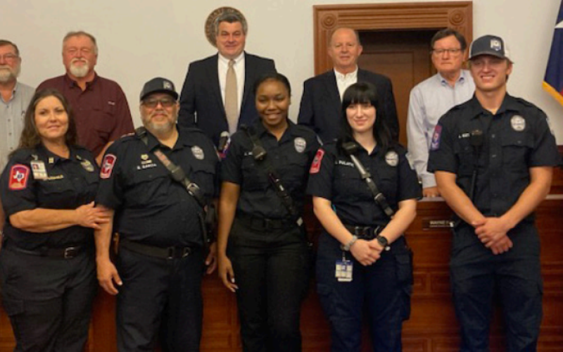 At Monday’s Lavaca County Commissioners’ Court meeting, the court declared the week of May 19-25 as Emergency Medical Services Week. Members of the Lavaca County EMS team were present for the meeting front from left are Lavaca County EMS chief Michael A. Furrh, Captain Melissa Leopold, FTO Steve Garcia, AEMT Aiyanna Adams, Paramedic Abby Pulatie, EMT Austin Kutac and Assistant chief Tim Decker.